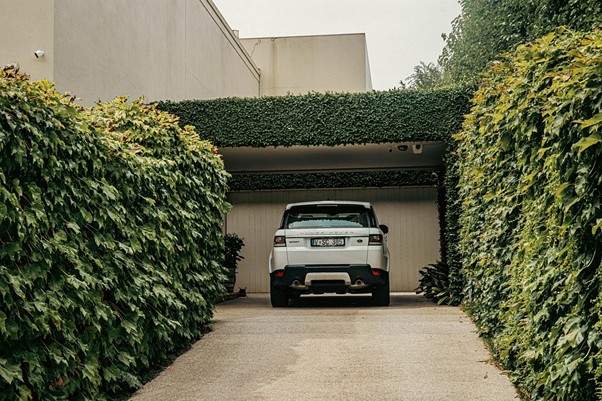 Image showing a white car parked in a garage.